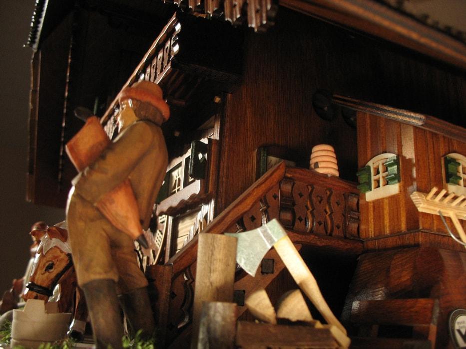 Cuckoo Clock - Rombach & Haas (Romba) Model 8393 FARMER COUPLE 8-Day Black Forest Cuckoo Clock With Intricately Carved Animated Figures, Chalet Style