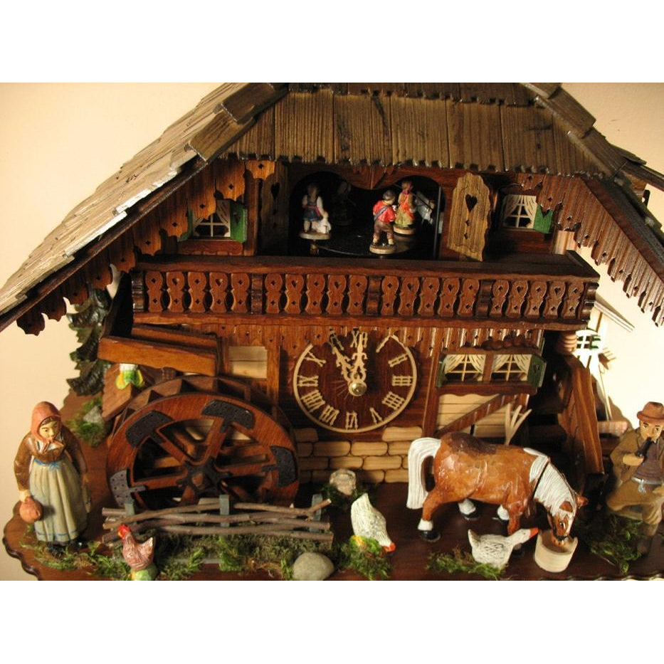 Rombach & Haas (Romba) Model 8393 FARMER COUPLE 8-Day Black Forest Cuckoo Clock with Intricately Carved Animated Figures, Chalet Style