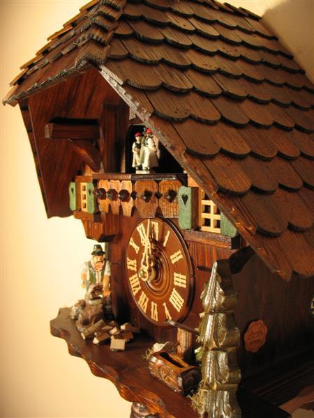 Cuckoo Clock - Rombach & Haas (Romba) WOODCHOPPER Model 8362, 8-Day Black Forest Cuckoo Clock, Chalet Style With Music Box And Dancers
