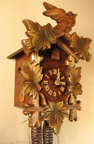 Cuckoo Clock - Rombach & Haas (Romba) BIRD AND LEAVES FOREST FINISH Model 1203 1-Day Black Forest Cuckoo Clock With Half And Full Hour Call, Lighter Linden Wood