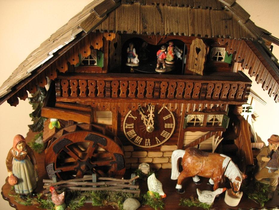 Cuckoo Clock - Rombach & Haas (Romba) Model 8393 FARMER COUPLE 8-Day Black Forest Cuckoo Clock With Intricately Carved Animated Figures, Chalet Style