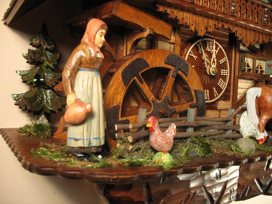 Cuckoo Clock - Rombach & Haas (Romba) Model 8393 FARMER COUPLE 8-Day Black Forest Cuckoo Clock With Intricately Carved Animated Figures, Chalet Style