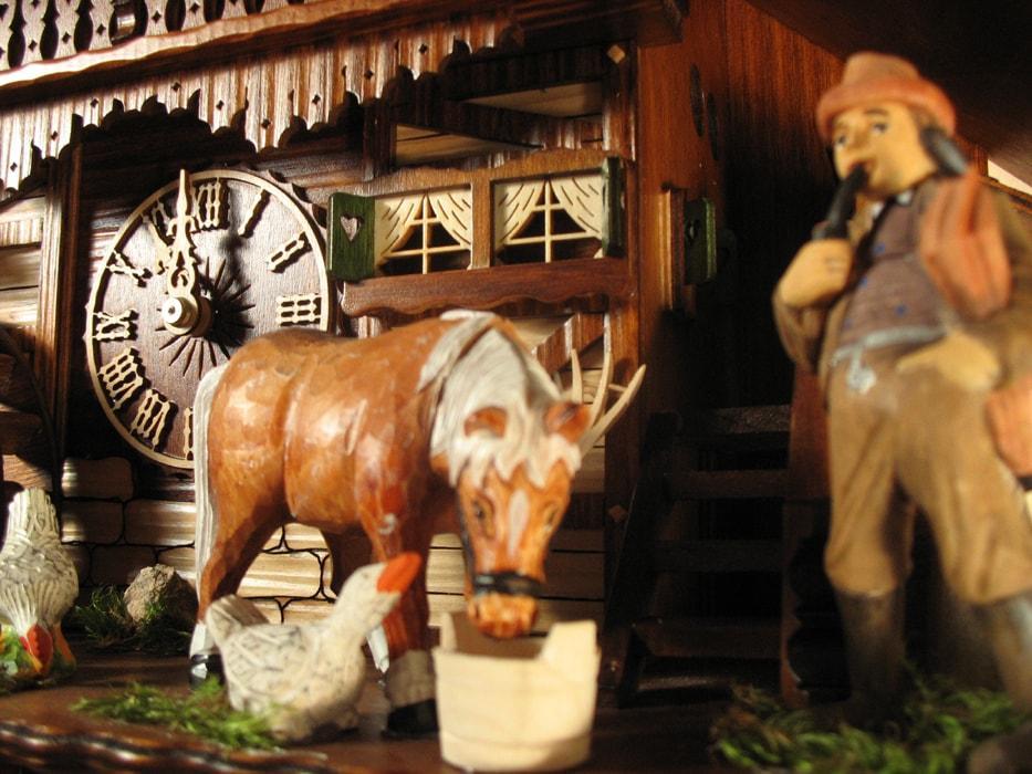 Cuckoo Clock - Rombach & Haas (Romba) Model 8393 FARMER COUPLE 8-Day Black Forest Cuckoo Clock With Intricately Carved Animated Figures, Chalet Style
