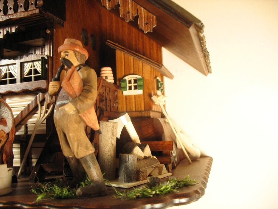 Cuckoo Clock - Rombach & Haas (Romba) Model 8393 FARMER COUPLE 8-Day Black Forest Cuckoo Clock With Intricately Carved Animated Figures, Chalet Style